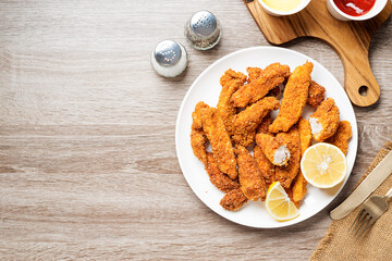 Delicious crispy fried breaded chicken breast strips . top view