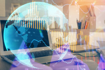 Financial graph colorful drawing and table with computer on background. Double exposure. Concept of international markets.