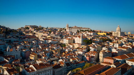 Fototapeta na wymiar Aerial view or drone sjot of Lisbon old town in sunset.