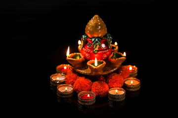 Indian Festival Diwali , oil lamp and flower design on dark background