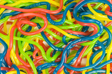 background of chewy gummy candy spaghetti strings - 384520681