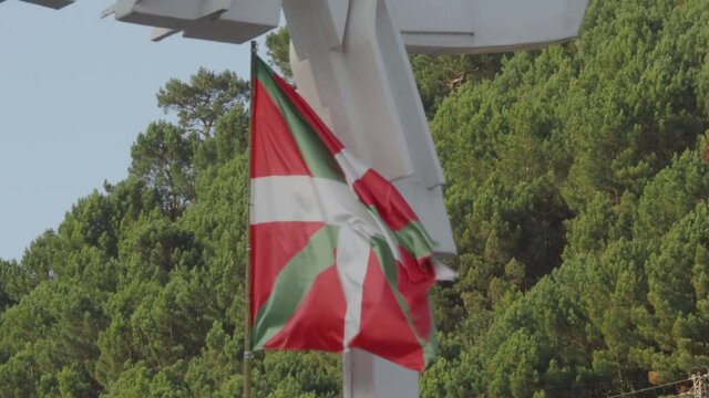 Flag of the Basque Country waving in the wind. Ikurri&ntilde;a