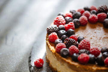 Two-layer cheesecake decorated with berries