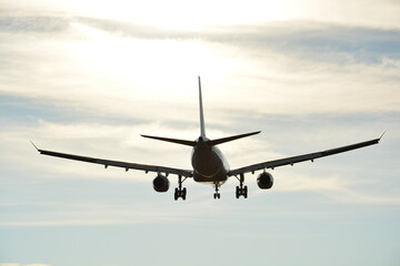 Naklejka na ściany i meble Airplane landing at barcelona airport