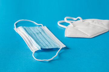 Different type face mask on blue background.