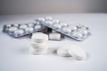 A lot of pills on the white background.