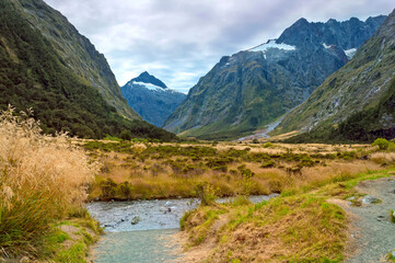 Fototapeta na wymiar Beautiful view of mountains with glacier tops from Monkey Creek, Fiordland park, New Zealand