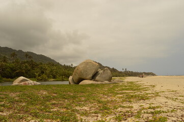 Naklejka premium The stunning beaches and mountains of Parque Nacional Natural Tayrona in Santa Marta region of Colombia