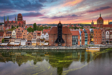 Obraz premium Aerial view of the Gdansk city over Motlawa river with amazing architecture at sunset, Poland