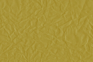 Yellow vintage and old looking crumpled paper background. Retro cardboard texture. Grunge paper for drawing. Ancient book page. Present wrapping.