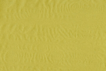 Yellow vintage and old looking crumpled paper background. Retro cardboard texture. Grunge paper for drawing. Ancient book page. Present wrapping.