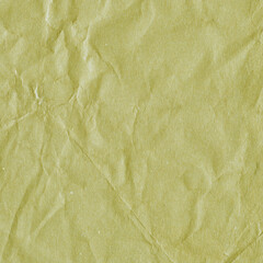 Yellow vintage and old looking crumpled paper background. Retro cardboard texture. Grunge paper for drawing. Ancient book page. Present wrapping.