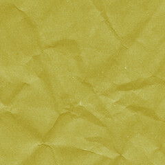 Yellow vintage and old looking crumpled paper background. Retro cardboard texture. Grunge paper for drawing. Ancient book page. Present wrapping.
