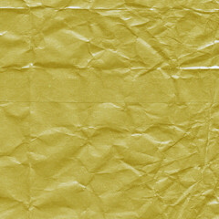 Yellow vintage and old looking crumpled paper background. Retro cardboard texture. Grunge paper for drawing. Ancient book page. Present wrapping.