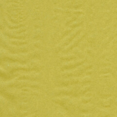 Yellow vintage and old looking crumpled paper background. Retro cardboard texture. Grunge paper for drawing. Ancient book page. Present wrapping.