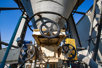 Phosphate fertilizers plant loader station. Hopper car train terminal. Hopper loader with control...