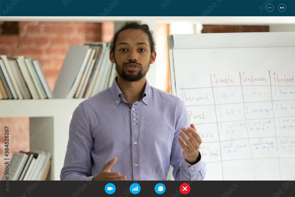 Wall mural screen view of motivated young african american male teacher or trainer talk speak on video call wit