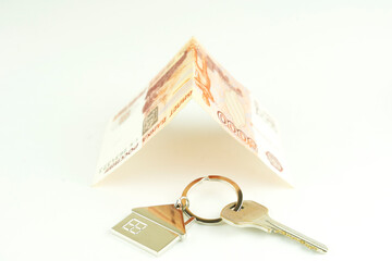 house key and money, the concept of a home purchase