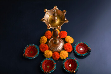 Colorful clay diya lamps lit during diwali celebration