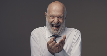 Cheerful businessman laughing out loud