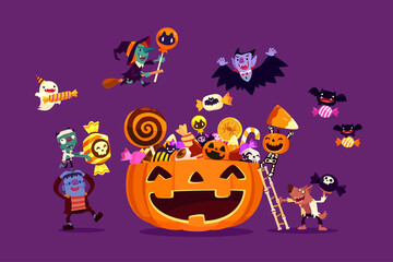 halloween monsters filling carved pumpkin with candies and sweets
