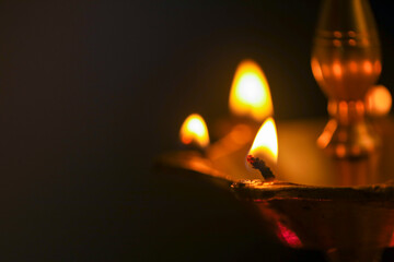 Colorful clay diya lamps lit during diwali celebration