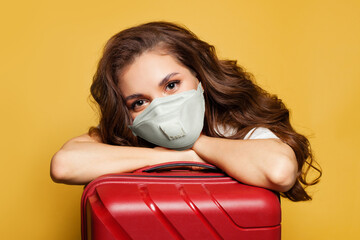 Woman traveler tourist passenger in protective medical mask. Travel, weekends and holidays with...