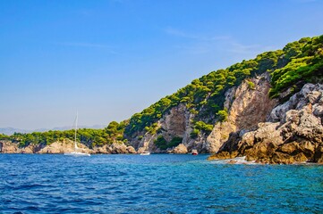 Naklejka premium Small yachts on the rocky coast of the Adriatic Sea. Croatia.