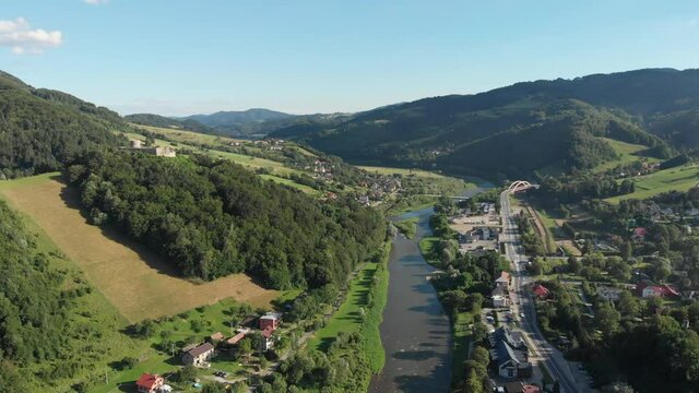 Aerial view of village Rytro, medieval castle and Poprad river in summer