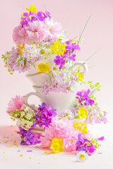 bouquet of wild flowers on pink
