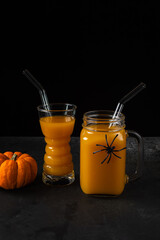 Pumpkin mocktails in glass and jar with straws