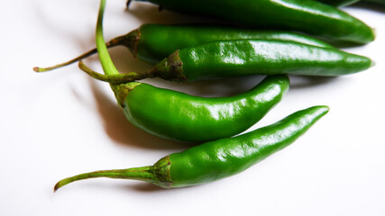 shot of Indian fresh green chillies isolated