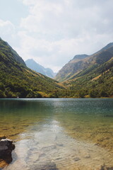 view of the lake in the mountains on a sunny day