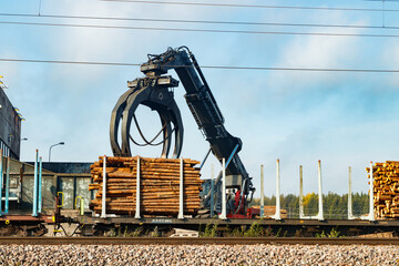 Kouvola, Finland - 24 September 2020: Unloading of timber from railway carriages at paper mill...