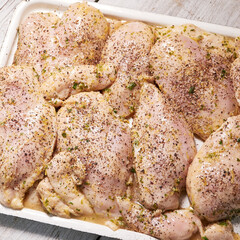 chicken fillet sprinkled with spices, pepper marinated for charcoal grilling