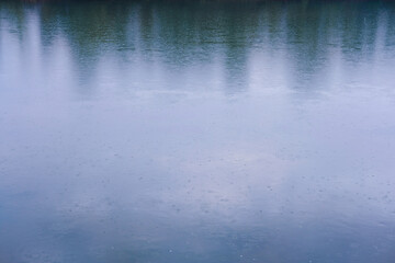 Fototapeta na wymiar a lot of ripples from raindrops
