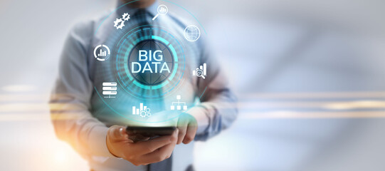 Big data analytics technology internet technology concept. Businessman pressing button on virtual screen.