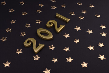 Happy New Year 2021. Sparkling gold numbers on black background with stars. object for design...