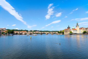 Obraz na płótnie Canvas River Vltava with Charles Bridge in the background view from the deck of the tourist boat, sightseeing cruise in Prague, Czech Republic, boheman region.