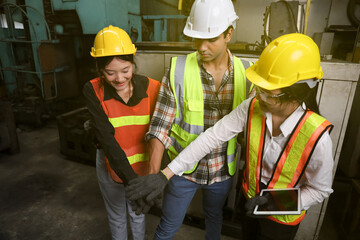 Leader supervisor training with new engineer and technician while working or operate in factory, stack hands teamwork 