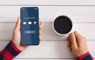 Student using smart phone with educational website