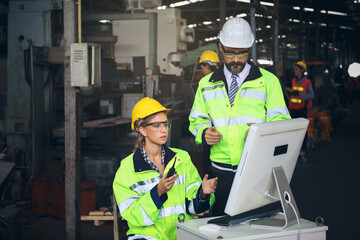 Engineer team inspect or checking the machine in workshop factory, the technician control for repair or maintenance part or equipment by radio and computer 