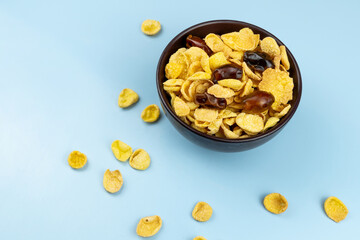 Healthy food cornflakes in a plate close up with dates