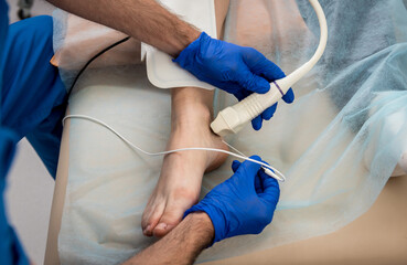 Cardiologist use tubes and ultrasound for radiofrequency catheter ablation.