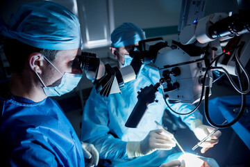A team of surgeons performing brain surgery to remove a tumor.