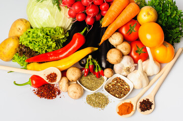 Vegetables and spices on a white background