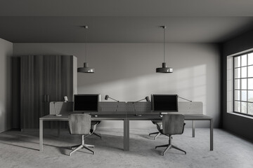 Modern gray open space office interior with wooden tables and wardrobe