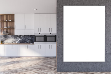 White and gray kitchen interior with cabinets and poster