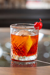 Red cherry cocktail on a restaurant table