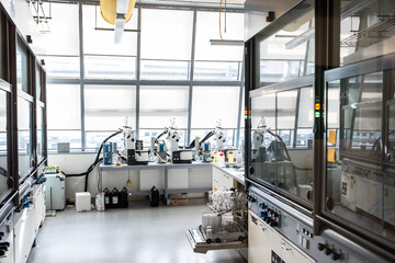Empty modern laboratory. Interior of biochemistry research laboratory. Science and technology theme, chemistry coolers and empty extractor hoods